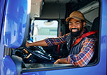 truck driver smiling sitting in truck